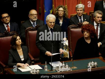 Newly elected Italian President Sergio Mattarella, center, flanked by Lower Chamber president Laura Boldrini, left, and vice-president of Italian Senate Valeria Fedeli, right, delivers his speech during his swearing-in ceremony at the Lower Chamber in Rome, Tuesday, Feb. 3, 2015. Sergio Mattarella on Monday resigned from his post as constitutional judge, a day before his swearing-in ceremony. Mattarella, 73, was elected as the new president on Saturday, in the fourth round of balloting held by Italian parliament in joint session. (AP Photo/Gregorio Borgia)