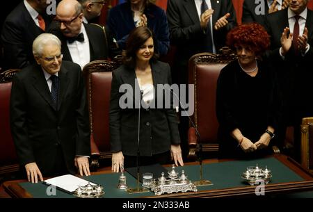 Newly elected Italian President Sergio Mattarella, left, flanked by Lower Chamber president Laura Boldrini, center, and vice-president of Italian Senate Valeria Fedeli, right, arrives prior to the start of his swearing-in ceremony at the Lower Chamber in Rome, Tuesday, Feb. 3, 2015. Sergio Mattarella on Monday resigned from his post as constitutional judge, a day before his swearing-in ceremony. Mattarella, 73, was elected as the new president on Saturday, in the fourth round of balloting held by Italian parliament in joint session. (AP Photo/Gregorio Borgia)
