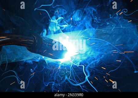 Metal worker  welding metals in factory, Randan, France Stock Photo