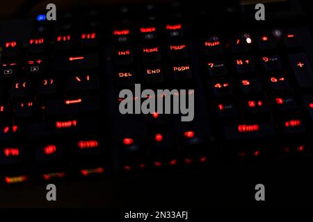 A sleek and stylish backlit gaming keyboard, perfect for gaming in the dark. The keyboard features a modern design and RGB lighting Stock Photo