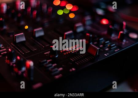 Close-up of an audio mixer with knobs and buttons, perfect for music production and audio engineering projects Stock Photo