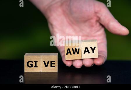 Cubes form the expression 'give away'. Stock Photo