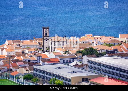 View of the Vila Franca with the clock tower of the town hall seen from the overlook at the Nossa Senhora da Paz or Our Lady of Peace chapel, at Vila Franca do Campo in Sao Miguel Island, Azores, Portugal. The village was established in the middle of the 15th century by Gonçalo Vaz Botelho. Stock Photo