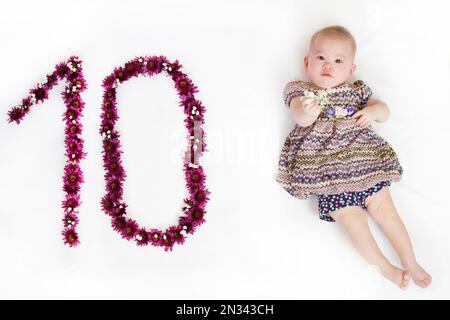 10-month-old baby girl. Baby milestone ten months. Ten month old baby Stock Photo