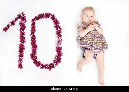 10-month-old baby girl. Baby milestone ten months. Ten month old baby Stock Photo