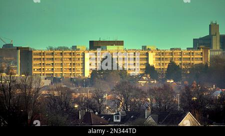 Glasgow, Scotland, UK  7th February, 2023. UK Weather:  Freezing temperatures overnight saw a foggy day clear and sun take advantage of the breaks in the cloud to produce Late sunshine on city hospitals. The new building Gartnavel General Hospital in late afternoon. Credit Gerard Ferry/Alamy Live News Stock Photo