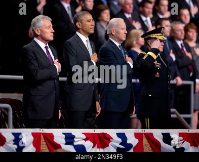 From left, outgoing Defense Secretary Chuck Hagel, President Barack Obama, Vice President Joe Biden and Joint Chiefs Chairman Gen. Martin Dempsey, put their hands over their heart as the National Anthem is played during the farewell tribute in honor of Hagel, Wednesday, Jan. 28, 2015, at Fort Myer in Arlington, Va. (AP Photo/Manuel Balce Ceneta)