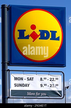 Lidl supermarket sign with opening hours Stock Photo