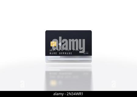 Credit card isolated on white background with reflection, isolated object, clipping path included, Business and financial concept. Stock Photo