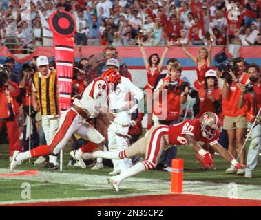 NFL FILE: Jerry Rice (80) and Steve Young (8) of the San Francisco 49ers  during Super Bowl XXIX at Joe Robbie Stadium in Miami, Florida. Young threw  a record 6 touchdowns and