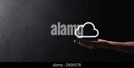 Businessman hand holding cloud computing concept in palm. Backup Storage Data Internet, networking and digital, Share global, and technology, concept Stock Photo