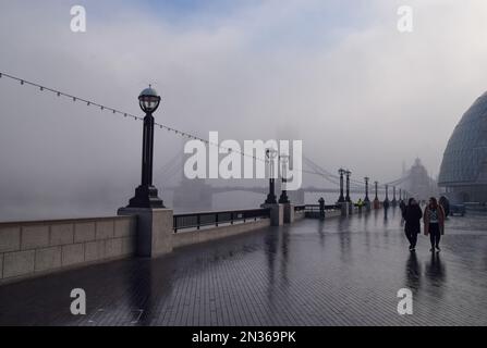 London, UK. 7th February 2023. Thick fog covers Tower Bridge. Stock Photo