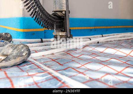 staple tacker gun for underfloor heating pipes Stock Photo