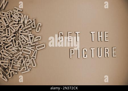 PICTURE in wooden English words language capital letters spilling from ...