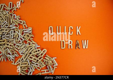 QUICK DRAW in wooden English language capital letters spilling from a ...