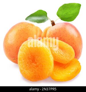 Delicious dried apricots and fresh apricots isolated on white background. Macro shot. Stock Photo