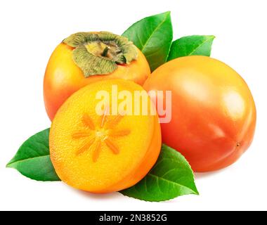 Ripe orange persimmon fruits or kaki fruits with leaves and cross cut of fruit isolated on white background. Stock Photo