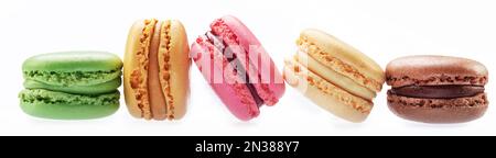 Colorful french macarons isolated on white background. Stock Photo