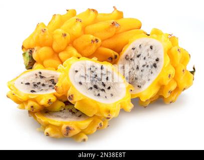 Yellow dragon fruit and dragon fruit slices isolated on white background. Stock Photo