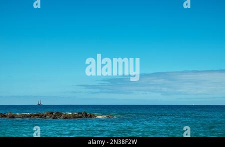 Calm ocean water and deep blue sky at the background. Stock Photo