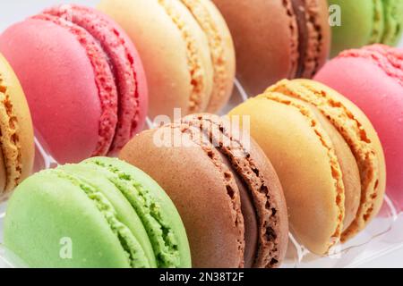 Colorful french macarons close up. Food background. Stock Photo
