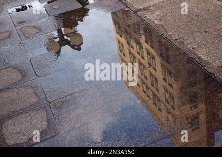 Reflections of Buildings in Puddle, Sparks Street Mall, Ottawa, Ontario, Canada Stock Photo