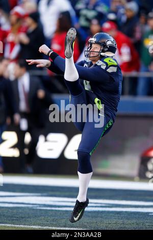 Seattle Seahawks punter Jon Ryan (9) bobbles the ball while running for 26  yards on a fake punt against the Los Angles Rams at CenturyLink Field in  Seattle, Washington on December 15