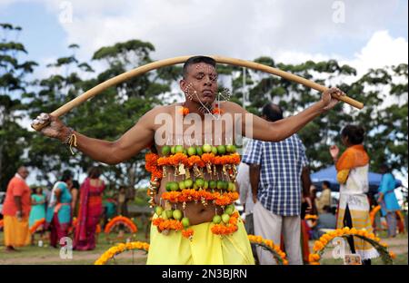 Durban, South Africa. 04th Feb, 2023. A Hindu devotee from Havenside Grammadave Alayam temple reacts as he is in pain from spikes on the body during the annual Thaipoosam Kavady festival at Chatsworth, south of Durban, South Africa on February 4, 2023. During the festival devotees are hooked with spikes, lime, coconuts, fruits and flowers on their bodies including their tongues as a sacrifice to their god, Muruga in return for purification. (Photo by Mabhuti Msweli/Sipa USA) Credit: Sipa USA/Alamy Live News Stock Photo