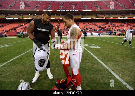 Oakland Raiders guard Austin Howard (77) and San Francisco 49ers outside  linebacker Aaron Lynch (59) during