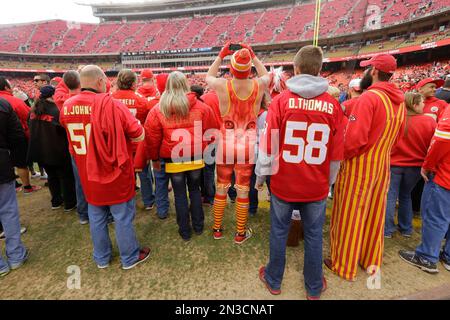 A Kansas City Chiefs fan wearing a head dress tries to get the attention of  a player before the Chiefs-Arizona Cardinals game at the University of  Phoenix Stadium in Glendale, December 7