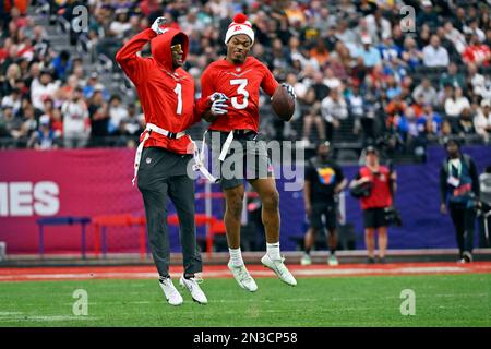 AFC strong safety Derwin James (3) of the Los Angles Chargers celebrates  with AFC cornerback Sauce Gardner (1) of the New York Jets during the flag  football event at the Pro Bowl