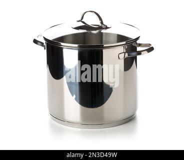 Large stainless steel cooking pot with glass lid on top elevated view over white background Stock Photo