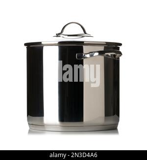 Large stainless steel cooking pot with glass lid side view over white ...