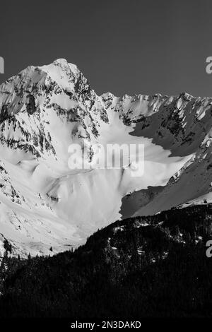 Close-up of snow covered mountain peaks at Resurrection Bay near Seward; Seward, Alaska, United States of America Stock Photo