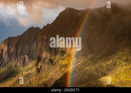 Rainbow over Pu'u o Kila lookout on Kauai, a spectacular location that gives a panoramic view of Kalalau Valley Stock Photo