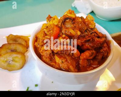 assortment of seafood served in a white bowl Stock Photo