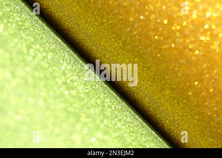 gold green glitter paper abstract, sparkle lights and bokeh, natural grunge texture background Stock Photo