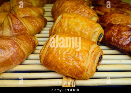 French bakery, fresh baked sweet buns and rolls on display in small French bakery in Paris, France Stock Photo