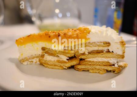 Traditional Portuguese cake with cream, fruits and cookies close up Stock Photo