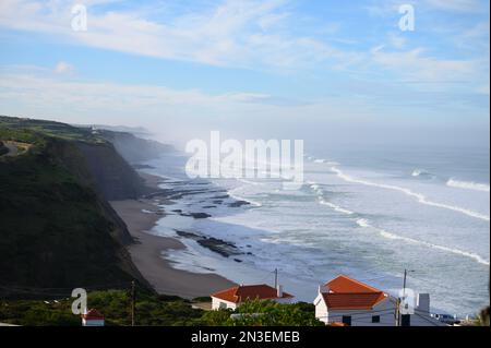 Magoito Beach on Atlantic ocean during storm and high waves, beautiful sandy beach on Sintra coast, Lisbon district, Portugal, part of Sintra-Cascais Stock Photo