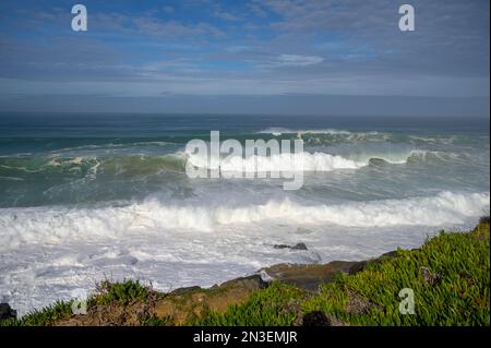 Magoito Beach on Atlantic ocean during storm and high waves, beautiful sandy beach on Sintra coast, Lisbon district, Portugal, part of Sintra-Cascais Stock Photo