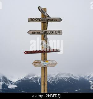 Post with international destinations at a ski resort in Banff National Park, Alberta, Canada; Improvement District No. 9, Alberta, Canada Stock Photo