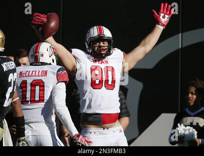 Utah tight end Westlee Tonga, right, celebrates his touchdown catch with  wide receiver Delshawn McClellon during the third quarter of Utah's 38-34  victory over Colorado in an NCAA college football game in Boulder, Colo.,  on Saturday, Nov. 29, 2014. (AP