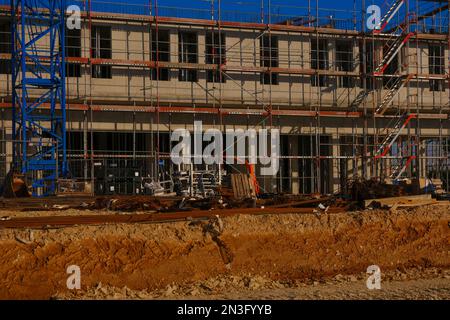 Construction of real estate and industrial premises concept.Foundation and walls of the house in scaffolding.Building materials and the process of Stock Photo