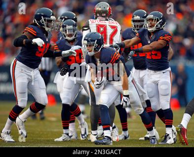 Chicago Bears free safety Chris Conte (R) is tacked by Minnesota Vikings  fullback Jerome Felton after returning an interception 35 yards during the  second quarter at Soldier Field on November 25, 2012