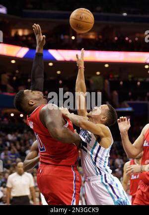 Brian Roberts of Charlotte Hornets, right, plays a shot against Los Angeles  Clippers in a basketball match during the NBA Global Games in Shanghai, Ch  Stock Photo - Alamy