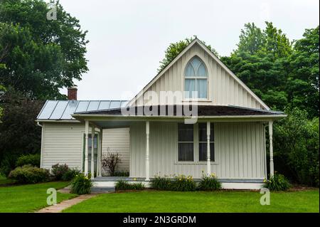 The American Gothic House made famous in a painting by Grant Wood; Eldon, Iowa, United States of America Stock Photo