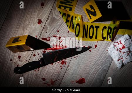 Flat lay composition with evidences and crime scene markers on wooden background Stock Photo