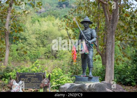 Nakhon Nayok Thailand - January 7 2022: The Stone Statues Chao Pho Khun Dan Shrine knife in hand and stand in Wat Khao Khok, very famous for tourist a Stock Photo