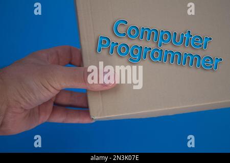 Computer Programmer word with cardboard box. Brown folded card box ...